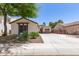 Well maintained home with desert landscaping and a long driveway leading to a two car garage at 6805 S Sapphire Way, Chandler, AZ 85249