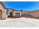 Desert themed yard with rock landscaping and a long driveway leading to a one car garage at 6805 S Sapphire Way, Chandler, AZ 85249