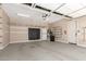 Spacious garage with ample storage, overhead lighting, and an epoxy floor at 6805 S Sapphire Way, Chandler, AZ 85249