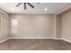 Bright living room featuring neutral colors, tiled floors, and a large window at 6805 S Sapphire Way, Chandler, AZ 85249