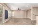 Spacious living room features tile flooring, neutral colors, and a ceiling fan at 6805 S Sapphire Way, Chandler, AZ 85249