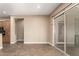Living room featuring tiled floors and sliding glass doors to a patio area at 6805 S Sapphire Way, Chandler, AZ 85249