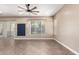 Bright and airy living space with neutral paint, tile floors, and a ceiling fan at 6805 S Sapphire Way, Chandler, AZ 85249