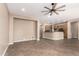 Spacious living area with tile flooring, featuring a kitchen view and neutral walls at 6805 S Sapphire Way, Chandler, AZ 85249