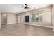 Bright and airy living space with neutral paint, tile floors, ceiling fan, and natural light at 6805 S Sapphire Way, Chandler, AZ 85249