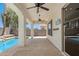 Covered patio area overlooking the pool, with ceiling fans for a comfortable outdoor experience at 6805 S Sapphire Way, Chandler, AZ 85249