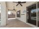 Spacious covered patio featuring ceiling fans and access to the backyard pool area at 6805 S Sapphire Way, Chandler, AZ 85249