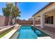 Sparkling pool and patio, featuring lush greenery and a view of the serene backyard at 6805 S Sapphire Way, Chandler, AZ 85249