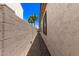 Property side yard featuring a brick-paved walkway between the house and a block wall at 6805 S Sapphire Way, Chandler, AZ 85249