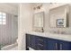 Stylish bathroom with double vanity, marble countertops, and modern fixtures, offering a luxurious feel at 6958 W Morning Dove Dr, Glendale, AZ 85308
