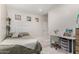 Comfortable bedroom with neutral colors and a cozy desk area and ample lighting at 6958 W Morning Dove Dr, Glendale, AZ 85308