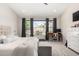 Bedroom featuring a serene atmosphere, a comfortable seating bench and a relaxing backyard view at 6958 W Morning Dove Dr, Glendale, AZ 85308