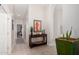 Inviting hallway with archway entry and stylish decor elements, seamlessly connecting different areas of the home at 6958 W Morning Dove Dr, Glendale, AZ 85308