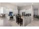 Spacious kitchen features a large center island with seating, white cabinetry, and stainless steel appliances at 6958 W Morning Dove Dr, Glendale, AZ 85308