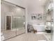 Elegant main bathroom with a freestanding tub, glass shower, and modern finishes at 6958 W Morning Dove Dr, Glendale, AZ 85308