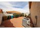 Exterior features a gravel yard, patio seating, rose bushes, and air conditioning unit at 7110 N 28Th Dr, Phoenix, AZ 85051