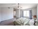 Relaxing bedroom with vaulted ceiling, a ceiling fan, and ample natural light at 7110 N 28Th Dr, Phoenix, AZ 85051