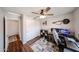 Bedroom with hardwood floors, closet, ceiling fan, gaming setup and natural light at 7110 N 28Th Dr, Phoenix, AZ 85051