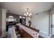 Open dining area featuring a large table, stylish chairs, and access to the living room at 7110 N 28Th Dr, Phoenix, AZ 85051