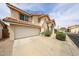 Two-story home with a tile roof, two-car garage, and a well-maintained yard in a residential neighborhood at 7110 N 28Th Dr, Phoenix, AZ 85051