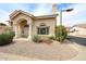 Well-maintained home featuring a tile roof, stucco exterior, and landscaped yard with vibrant yellow flowers at 7110 N 28Th Dr, Phoenix, AZ 85051