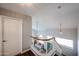 Bright foyer with a staircase overlooking the living area, featuring high ceilings and modern light fixtures at 7110 N 28Th Dr, Phoenix, AZ 85051
