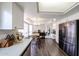 Spacious open-concept kitchen with stainless steel appliances, dining area, and access to other rooms at 7110 N 28Th Dr, Phoenix, AZ 85051