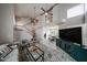Open-concept living area with a fireplace, high ceilings, and contemporary furnishings at 7110 N 28Th Dr, Phoenix, AZ 85051