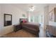Bedroom with a tray ceiling, light-colored walls, and an earth-toned color palette at 7307 E Black Rock Rd, Scottsdale, AZ 85255