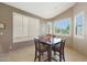Dining area featuring plantation shutters that provide natural light at 7307 E Black Rock Rd, Scottsdale, AZ 85255