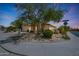 Charming single-story home with a desert-landscaped front yard, spacious driveway, and a two-car garage at 7307 E Black Rock Rd, Scottsdale, AZ 85255