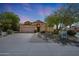 Charming single-story home with a desert-landscaped front yard, spacious driveway, and a two-car garage at 7307 E Black Rock Rd, Scottsdale, AZ 85255