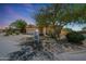 Charming single-story home with a desert-landscaped front yard, spacious driveway, and a two-car garage at 7307 E Black Rock Rd, Scottsdale, AZ 85255