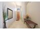 Inviting foyer featuring neutral walls, tiled floors, and a decorative table, creating a welcoming entrance at 7307 E Black Rock Rd, Scottsdale, AZ 85255