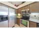 A well-equipped kitchen featuring stainless steel appliances and tiled backsplash at 7307 E Black Rock Rd, Scottsdale, AZ 85255