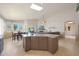 Bright and spacious kitchen featuring an island, tile floors, and an open view to the living room at 7307 E Black Rock Rd, Scottsdale, AZ 85255