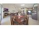 Open floor plan with a dining area, a cozy fireplace, and a modern kitchen at 7307 E Black Rock Rd, Scottsdale, AZ 85255
