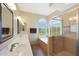 A main bathroom with double sinks, a walk-in shower, and a soaking tub at 7307 E Black Rock Rd, Scottsdale, AZ 85255
