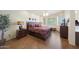 A main bedroom with wood floors, a ceiling fan, and lots of natural light at 7307 E Black Rock Rd, Scottsdale, AZ 85255