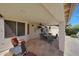 Spacious covered patio featuring a ceiling fan and outdoor seating, perfect for entertaining at 7307 E Black Rock Rd, Scottsdale, AZ 85255