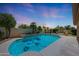 Inviting pool area with a stone pizza oven and desert landscaping at 7307 E Black Rock Rd, Scottsdale, AZ 85255