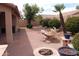 The expansive backyard boasts a fire pit, water feature, lush landscaping, and a built-in BBQ area at 8008 W Ross Ave, Peoria, AZ 85382