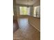 Bright dining area featuring tile flooring, breakfast bar, and large windows offering ample natural light at 8008 W Ross Ave, Peoria, AZ 85382