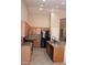 Well-equipped kitchen with stainless steel appliances, granite countertops, tile backsplash, and modern fixtures at 8008 W Ross Ave, Peoria, AZ 85382