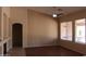 Bright and spacious living room boasting hardwood floors, a ceiling fan, and large windows with ample natural light at 8008 W Ross Ave, Peoria, AZ 85382