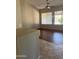 Spacious living room featuring hardwood floors, recessed lighting, ceiling fan and large windows at 8008 W Ross Ave, Peoria, AZ 85382
