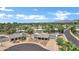 Aerial view of home featuring desert landscaping, solar panels, and a large circular driveway at 8936 N 80Th Pl, Scottsdale, AZ 85258