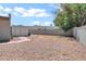 Spacious backyard featuring gravel landscaping, block fence, and a storage shed for added convenience at 8936 N 80Th Pl, Scottsdale, AZ 85258