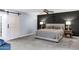Comfortable bedroom with carpet, fan, and king bed with lamps on each side at 8936 N 80Th Pl, Scottsdale, AZ 85258