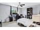 Modern bedroom with a desk, ceiling fan, and comfortable sleeping area at 8936 N 80Th Pl, Scottsdale, AZ 85258
